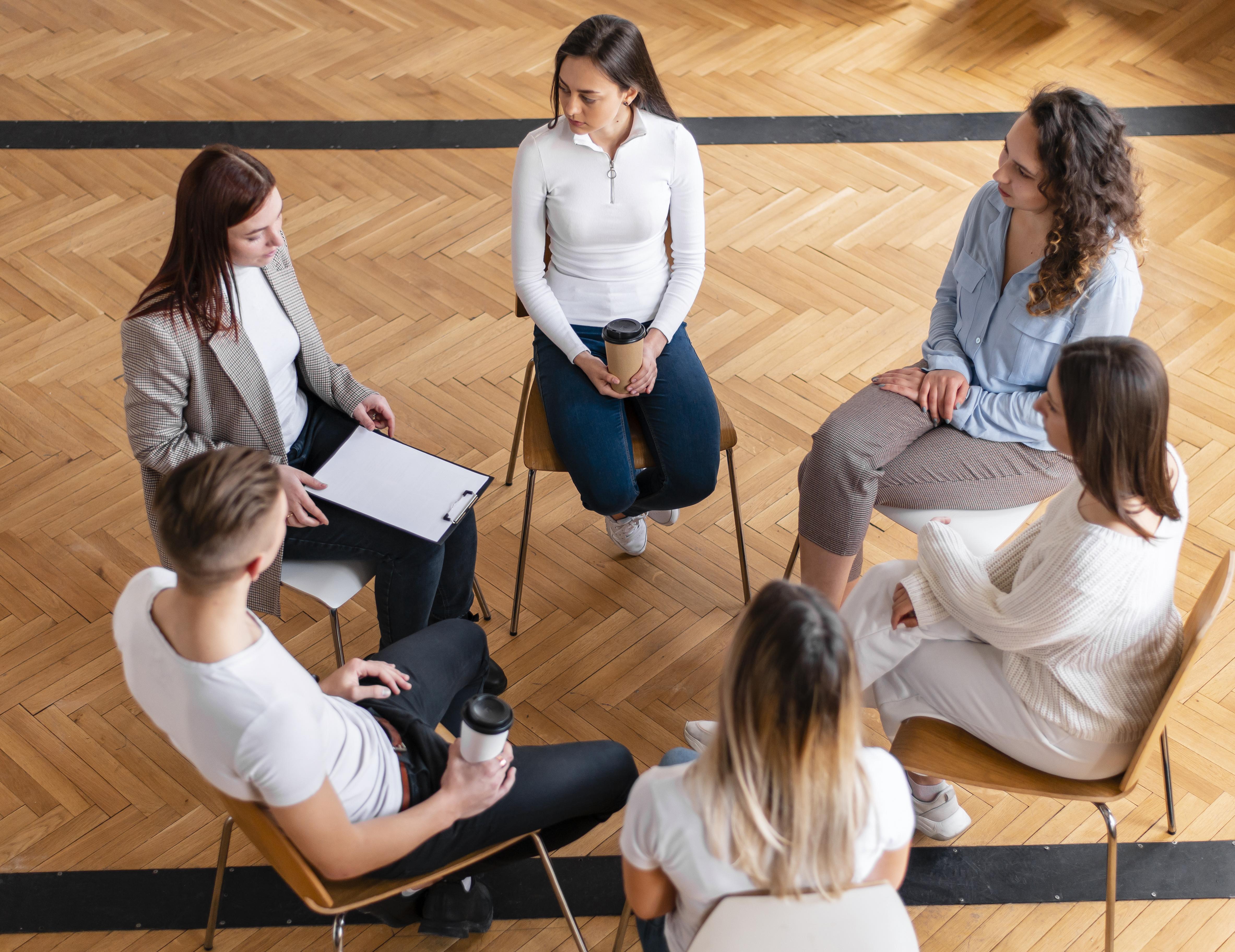 medium-shot-people-sitting-circle.jpg